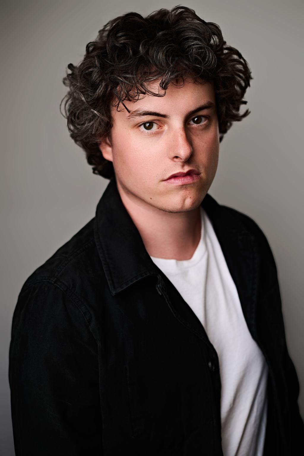 Frankie Seratch portrait, black shirt jacket over a white tee